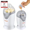 Two white and gray popcorn machines are shown against a white background. One machine is full of popcorn, and the other is being filled with popcorn kernels. Náhled obrázku produktu