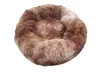 A round, fluffy pet bed with a raised edge, in shades of brown and tan. Produktbild-Vorschau