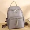 A gray backpack is displayed against a light-colored background. Podgląd zdjęcia produktu