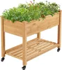 A wooden raised garden bed filled with plants, shown on a white background. Podgląd zdjęcia produktu