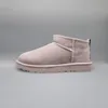 A single pale smoke colored UGG Classic Ultra Mini boot is shown against a plain gray background. Produktbild-Vorschau