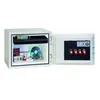 An open safe with various items inside, including documents, a camera, a CD, and keys. Voir les images du produit