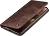 A brown leather flip case for a smartphone is shown from a diagonal angle, with the front cover partially open. Produktbild-Vorschau