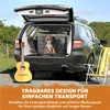 A dog in a crate in the back of an SUV, with a guitar and a beach chair nearby. Podgląd zdjęcia produktu
