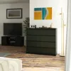 A modern living room with a TV, a dresser, and artwork. Anteprima dell’immagine prodotto