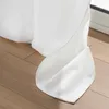 A close-up view of a white curtain draped over a wooden floor. Produktbild-Vorschau