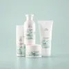 A collection of Wella Profis NUTRICURLS hair products arranged on a light blue background. Voir les images du produit