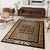A living room scene with a sofa, armchair, side table, and a rug with animal print patterns. Produktbild-Vorschau