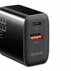 A close-up view of a black dual USB charger with USB-C and USB-A ports. Anteprima dell’immagine prodotto