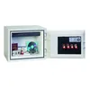 An open safe displaying various items inside and keys on the inside of the door. Voir les images du produit