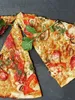 Close-up view of slices of pizza with toppings. Produktbild-Vorschau