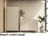 A modern living room setting with two beige furniture pieces, a tall wardrobe and a low cabinet, adorned with plants and soft lighting. Produktbild-Vorschau