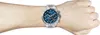 A man's arm wearing a Hugo Boss watch. Voir les images du produit