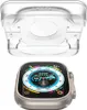 A clear plastic Apple Watch charger stand is shown above an Apple Watch. Podgląd zdjęcia produktu