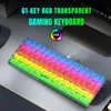 A transparent RGB gaming keyboard with rainbow backlighting is displayed on a desk. Produktbild-Vorschau
