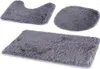 Three grey bath mats of different shapes and sizes are arranged on a white background. Náhled obrázku produktu