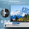 A TV screen displaying a mountain landscape, with an inset showing a USB drive being plugged into a device, and icons representing video, photos, and music. Produktbild-Vorschau