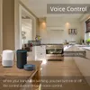 A kitchen scene with smart speakers on a table, and text overlays indicating voice control features. Podgląd zdjęcia produktu