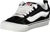A studio shot of a single black and white Vans sneaker. Voir les images du produit