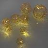 A string of warm white LED lights shaped into spherical, woven globes. Náhľad obrázku produktu