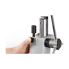 A close-up shot of a hand operating a part of a drilling stand. Náhľad obrázku produktu
