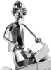 A metallic figurine of a construction worker laying bricks. Náhled obrázku produktu
