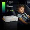 A sleeping child in a car seat next to a portable cooler. Anteprima dell’immagine prodotto