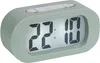 A digital alarm clock with a green casing and a digital display showing the time. Podgląd zdjęcia produktu