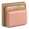 A pink lunchbox with two compartments is shown in front of its brown cardboard packaging. Podgląd zdjęcia produktu
