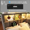 A bed with integrated storage and lighting features, with a top section showing a close-up of the speaker and charging ports. Náhled obrázku produktu