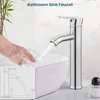 A hand is filling a glass with water from a bathroom sink faucet. An inset diagram shows the faucet's internal workings. Produktbild-Vorschau