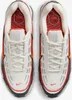 A top-down view of a pair of white Nike Air Max TL 2.5 sneakers with red and orange accents. Podgląd zdjęcia produktu