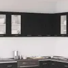A modern kitchen with black oak-effect cabinets and white walls. Produktbild-Vorschau