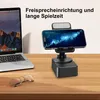 A smartphone stand with a speaker is placed on a wooden desk next to a laptop and glasses. Produktbild-Vorschau