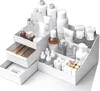 A white makeup organizer filled with various skincare and makeup products. Produktbild-Vorschau