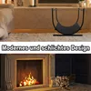 A split image showing a modern black firewood rack in the top half and a fireplace with burning logs in the bottom half. Náhled obrázku produktu