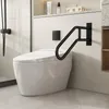 A modern bathroom with a white toilet and a black U-shaped grab bar mounted on the wall. Voir les images du produit