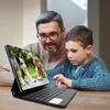 A father and son are looking at a tablet with a keyboard attachment. Náhled obrázku produktu