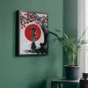 A framed painting of a samurai under a cherry blossom tree is displayed on a green wall next to a potted plant. Podgląd zdjęcia produktu