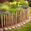 A garden bed with a wooden picket fence and various flowers and plants. Produktbild-Vorschau