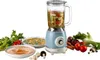 A blue vintage-style blender is shown on a white background, surrounded by fresh vegetables and bowls of soup. Anteprima dell’immagine prodotto