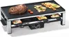 A raclette grill with food cooking on it. Produktbild-Vorschau