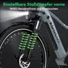 Close-up of the front suspension and wheel of a gray e-bike, with green springs highlighted. Produktbild-Vorschau