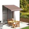 An outdoor patio scene with a table and chairs under an awning, next to a grill and a planter box. Anteprima dell’immagine prodotto