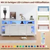A white sideboard with LED lighting and decorative items on top, shown with various color options and a remote control. Podgląd zdjęcia produktu