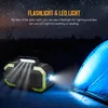 A portable device with lights on and a tent in the background at night. Podgląd zdjęcia produktu