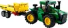 A green and yellow LEGO Technic John Deere tractor with a yellow trailer attached, shown from a three-quarter front angle against a white background. Anteprima dell’immagine prodotto