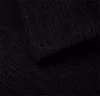 A close-up view of black fabric with a textured weave. Produktbild-Vorschau