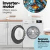 A washing machine in a laundry room setting. Voir les images du produit