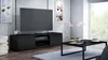 A modern living room with a black TV stand, a large TV, a coffee table, and decorative elements. Náhľad obrázku produktu